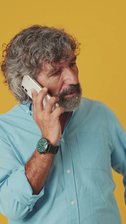 Surprised senior man talking on mobile phone, found out great big win, isolated Stock Footage 252503351