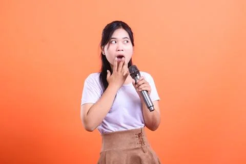 Surprised Singer with Microphone Stock Photos
