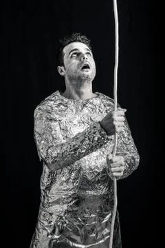 Surprised spaceman with rope Stock Photos