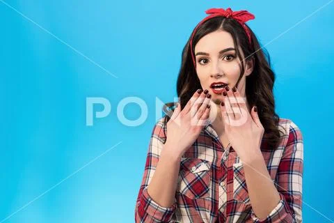 The surprised woman gesturing on the blue background Stock Photos