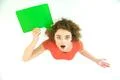 The surprised woman stand with the green dialog sign. View from above Photo