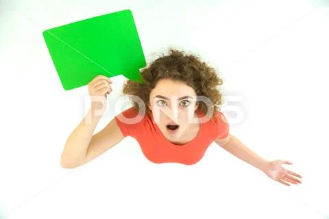 The surprised woman stand with the green dialog sign. View from above Stock Photos
