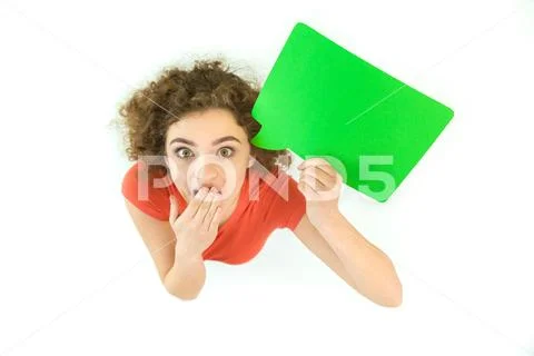 The surprised woman stand with the green dialog sign. View from above Stock Photos