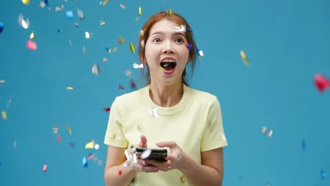 Surprised young Asia lady using mobile phone with positive expression. Video stock 154551682