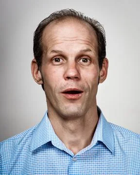 Surprised young man Stock Photos
