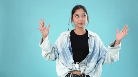 Surprised Young Woman Gesturing Big Concept Against Blue Background Vidéo 346113085