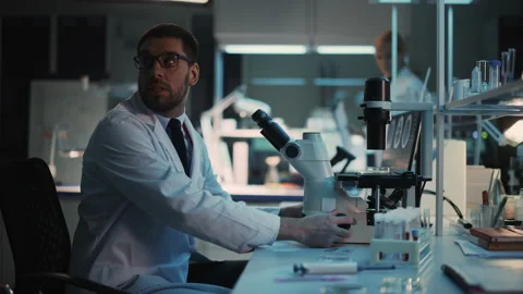 Surprized Scientist Makes Discovery Under Microscope Video stock 142226806