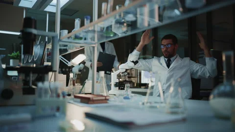 Surprized Scientist Makes Discovery Under Microscope Video stock 142226868