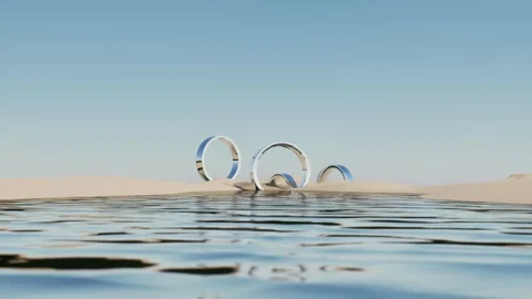 Surreal Abstract 3D Render of Reflective Chrome Rings on Sand Dunes Stock Footage 331573799