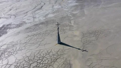 Surreal aerial view of sinking church in a decanting lake, tower with cross Stock Footage 317428341