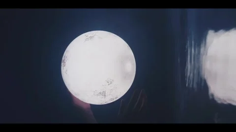 Surreal Cinematic Shot of a Hand Touching a Glowing Moon Stock Footage 335415531