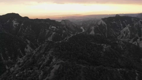 Surreal dramatic dark earth landscape panorama with beautiful cliff formation Stock Footage 148258707