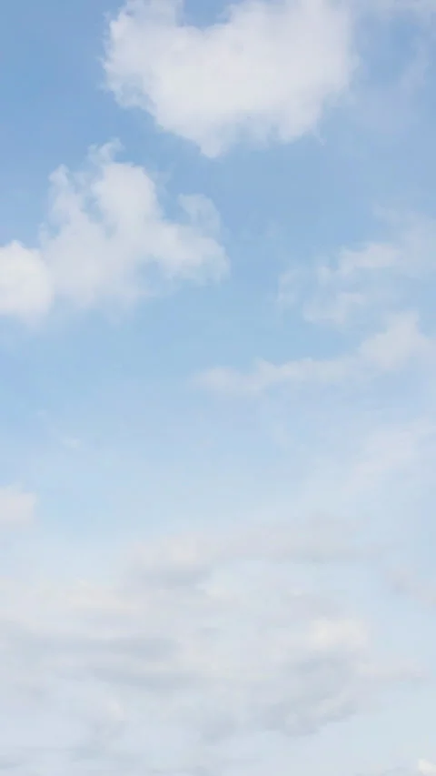A surreal drone timelapse capturing the movement of fluffy clouds Video stock 304194016