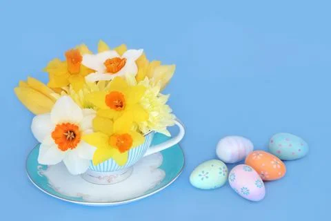 Surreal Easter Flowers in a Tea Cup with Decorated Eggs Stock Photos