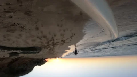 Surreal Figure on Beach Sunset Surf Board 2.7K- Stock Footage 175955828