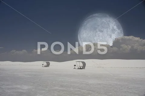 Surreal image with sleds and moon Stock Photos