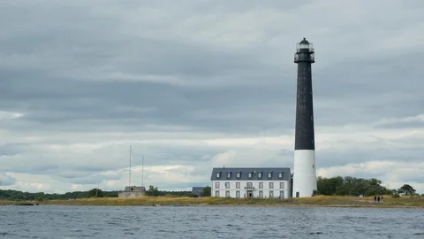 Surreal lighthouse on a cloudy day over the sea 2019.07.13 Vídeos de archivo 115030260