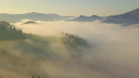 Surreal sunrise in the Smoky mountain skies. Drone video lifting up and panni Stock Footage