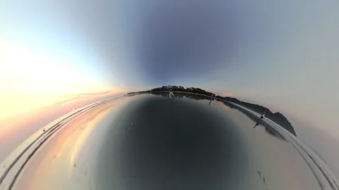 Surreal Tiny Planet Shot Of Boy Running Along The Wet Shoreline Stock Footage 306783963