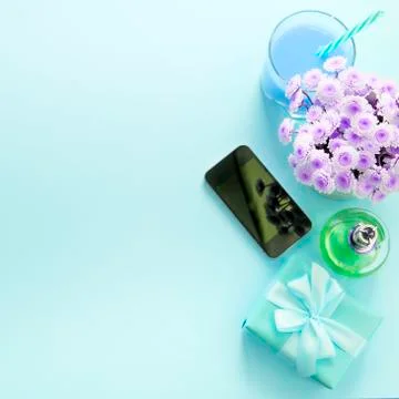 Surrealiam Composition flat lay gift to a woman. Modern gadget mobile phone g Stock Photos