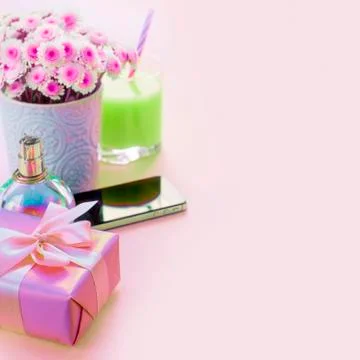 Surrealism Composition flat lay gift to a woman Modern gadget mobile phone gl Stock Photos