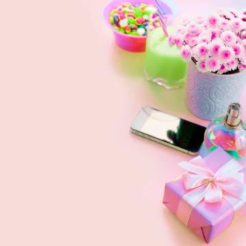 Surrealism Composition flat lay gift to a woman Modern gadget mobile phone gl Stock Photos