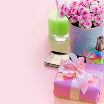 Surrealism Composition flat lay gift to a woman Modern gadget mobile phone gl Stock Photos