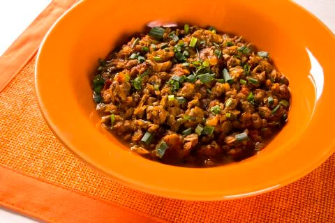 Sururu soup inside a orange plate. Brazilian dish. Stock Photos