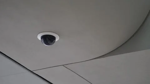 Surveillance camera on building ceiling Stock-Footage 338271877