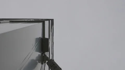 Surveillance camera on the building recorded from below Stock Footage 106028159