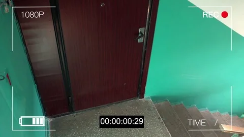 Surveillance camera caught the robber in a mask with a knife Stockbeeldmateriaal 77229445