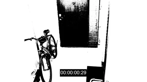 Surveillance camera caught the thief broke the door and stole the bike threshold Video stock 83721914