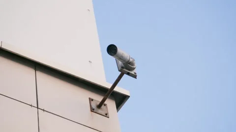 A surveillance camera hanging on the corner of the building. Stock Footage 302475185