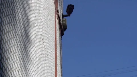 Surveillance camera hanging on the wall of a kindergarten on the background of Video stock 76089052