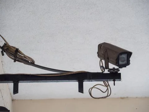 Surveillance Camera Mounted on Ceiling with Cables Stock-Fotos