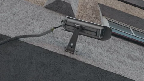 Surveillance Camera Positioned on Building Wall Capturing Urban Security Footage Stock Footage 307786597