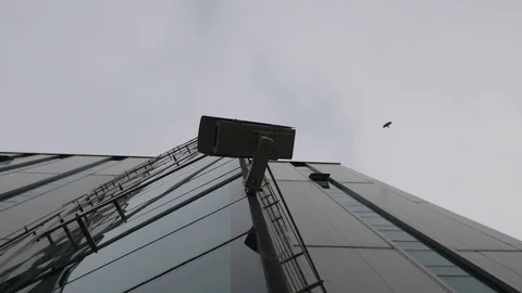 Surveillance camera recorded from below on the modern office building Video stock 106028404