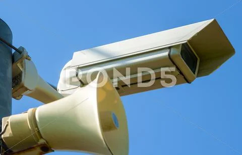 Surveillance Camera with siren on a pole Stock Photos