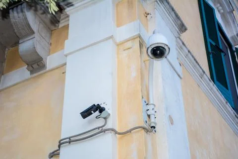 Surveillance camera on a wall of a building Stock Photos