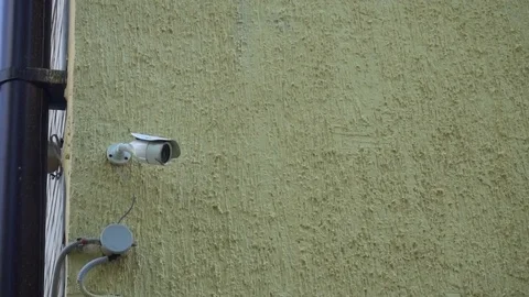 Surveillance camera on the wall of children's art school Stock Footage 77925440