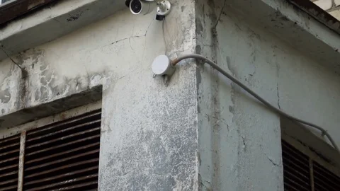 Surveillance camera on the wall of children's art school Stockbeeldmateriaal 77925540