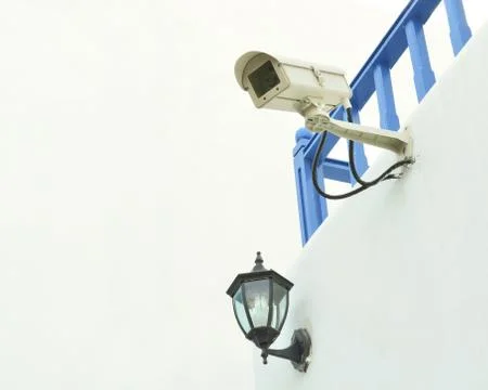 Surveillance camera on the wall 写真素材
