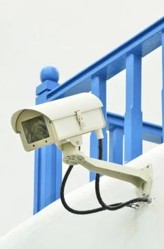 Surveillance camera on the wall Stock Photos