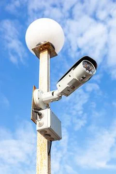Surveillance CCTV camera mounted on the post Stock Photos