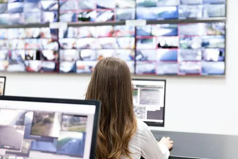 Surveillance control room operator at work Stock Photos