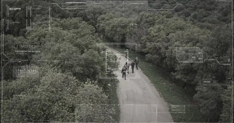 Surveillance drone camera view of terrorist squad walking with weapons Video stock 106680919