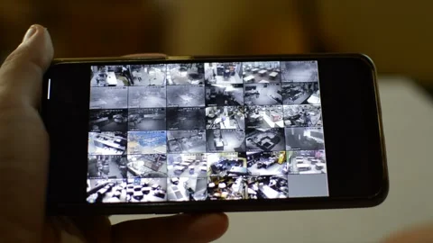 Surveillance security technology cctv on the phone monitor. split screen display Stock Footage 169626808