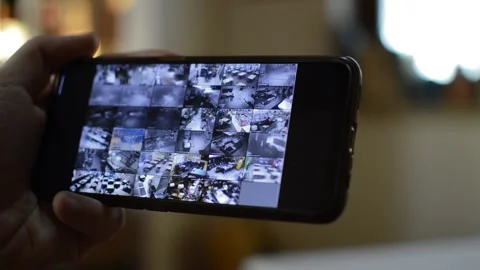 Surveillance security technology cctv on the phone monitor. split screen display Stock Footage 169626862