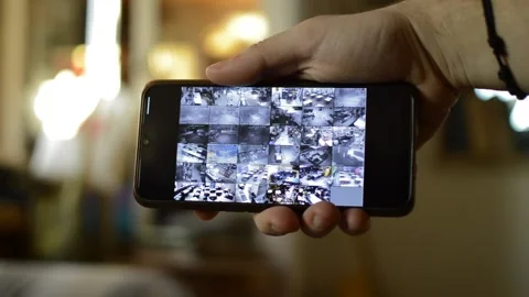 Surveillance security technology cctv on the phone monitor. split screen display Stock Footage 169626982