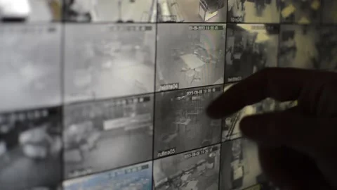 Surveillance security technology cctv on the phone monitor. split screen display Stock Footage 169643442